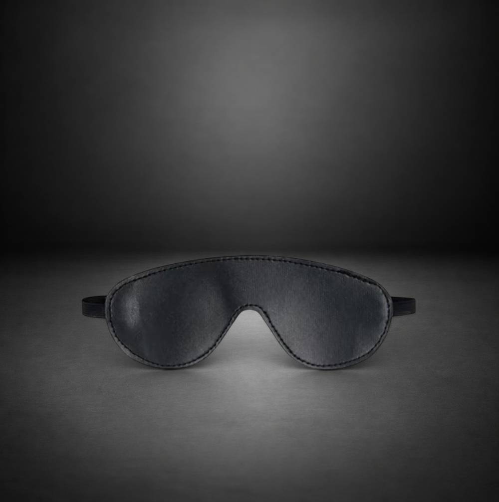 RealCock Toys black faux leather blindfold with stitched edges and elastic strap for sensory play
